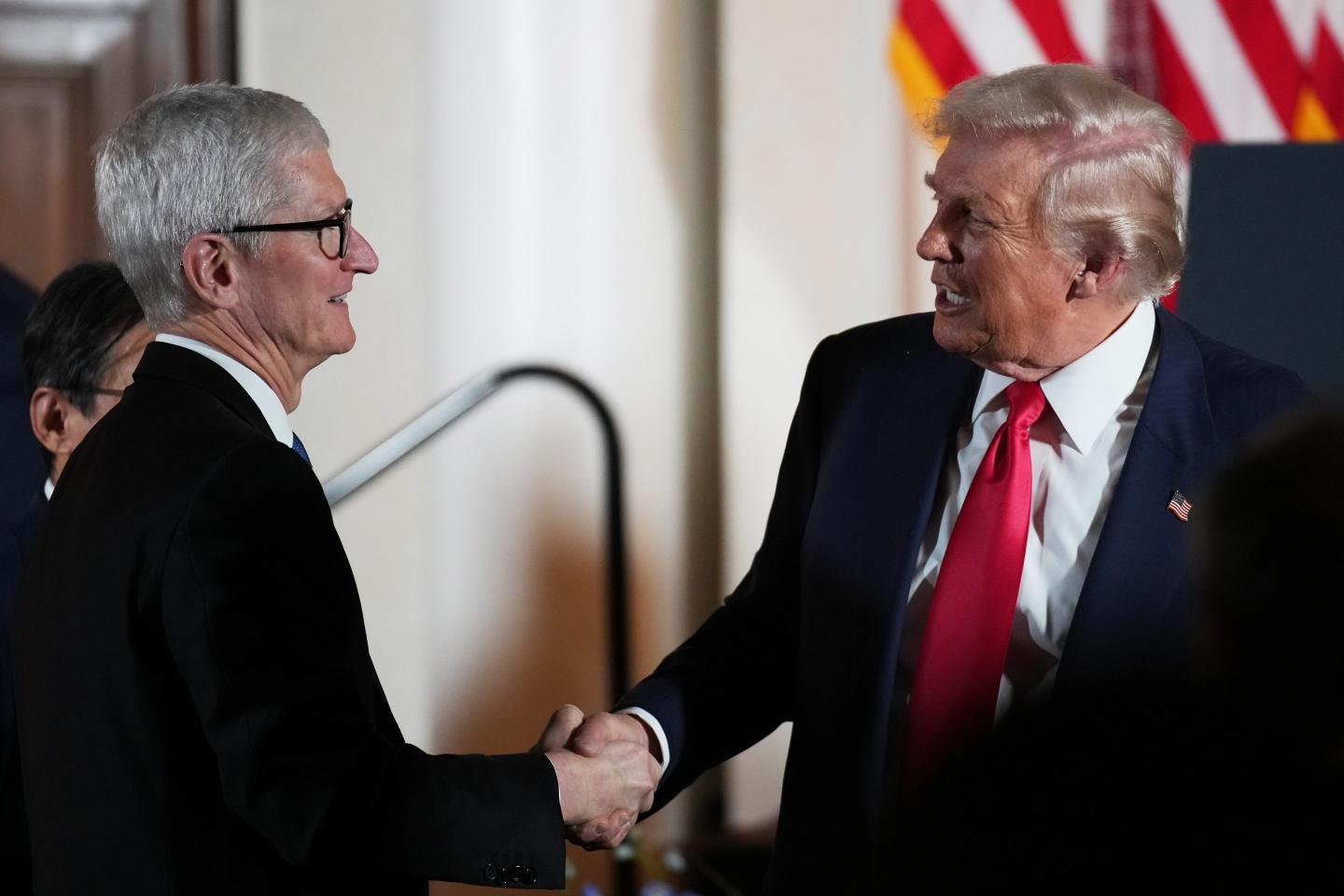 Trump and Cook shake hands