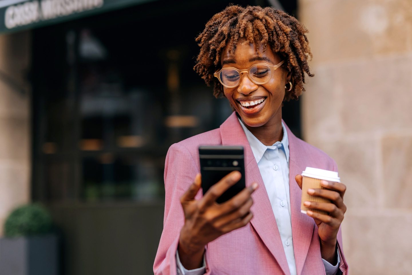 Worker smiles happily at phone