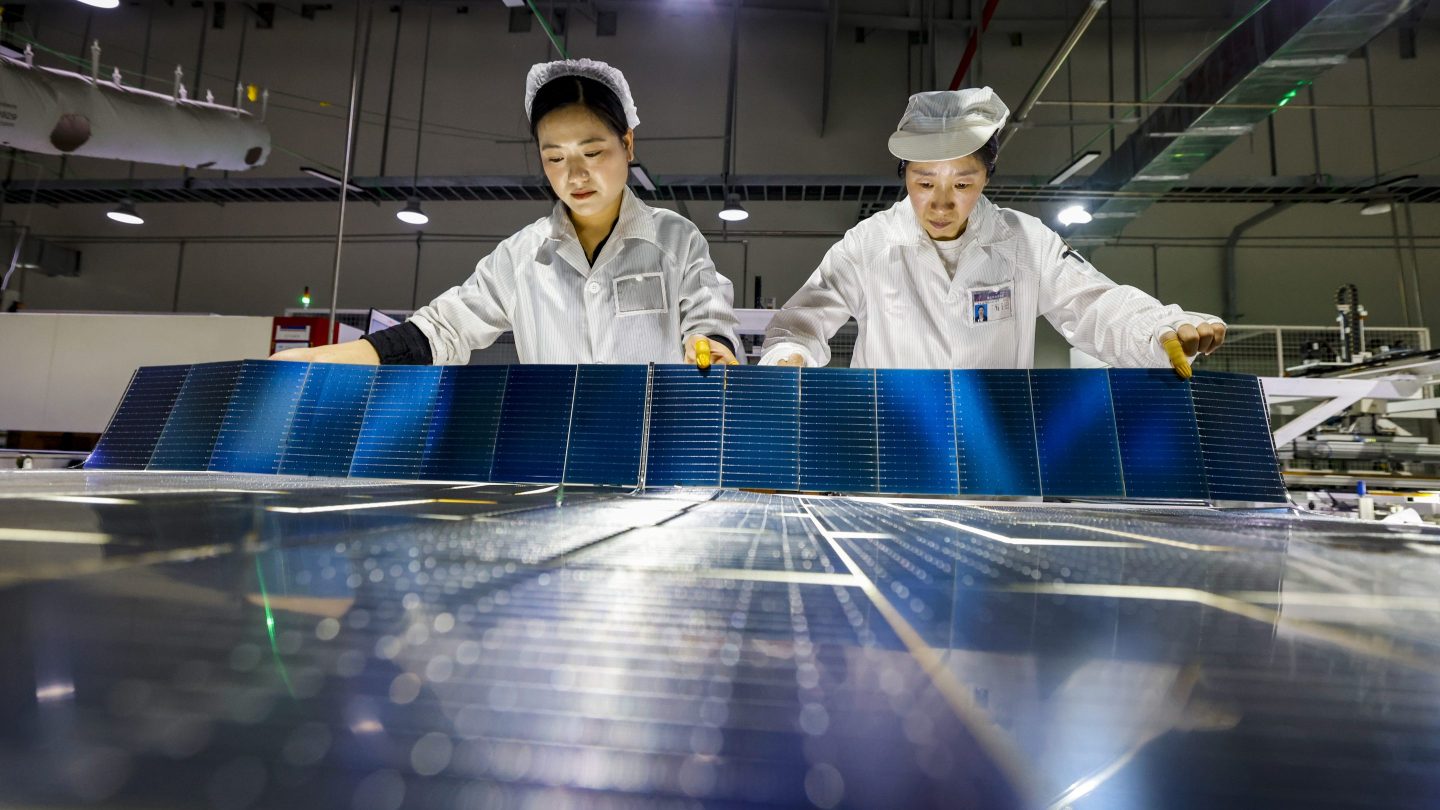 Workers on the production line of solar panels in China