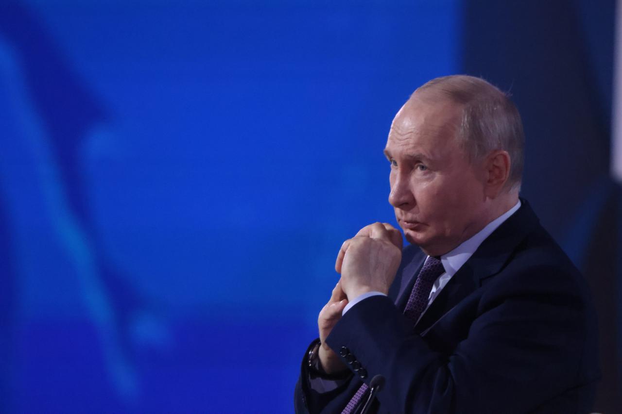 Putin finally admits Russia's economy is in trouble and grasps for ...