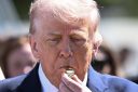 US President Donald Trump blows a whistle as children participate in the annual Easter Egg Roll on the South Lawn of the White House on April 6, 2026, in Washington, DC.