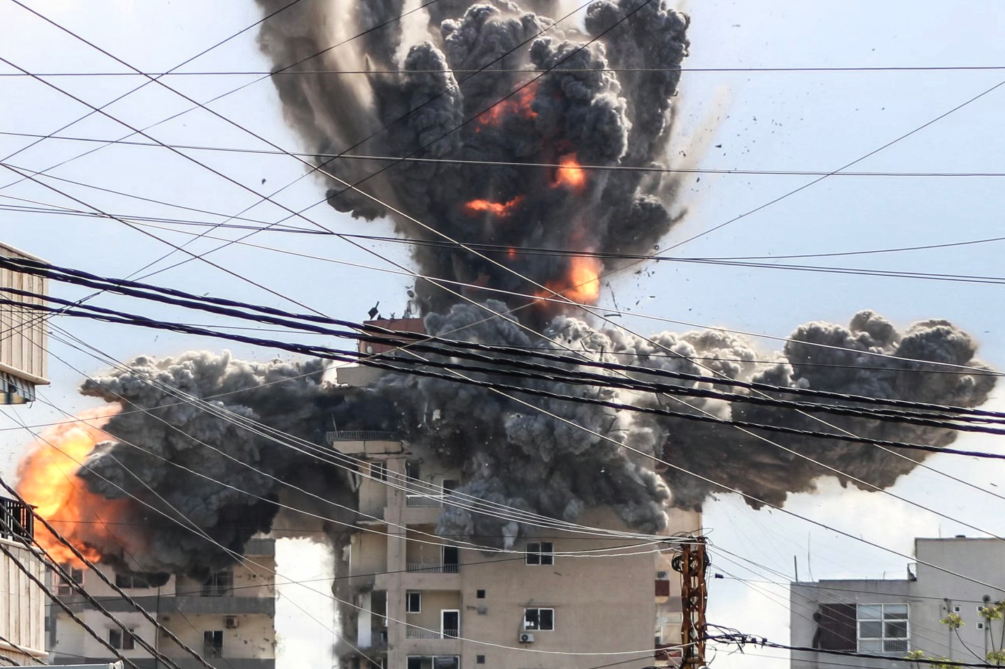 Photo: A fireball rises from a building hit by an Israeli airstrike in the area of Abbasiyeh, on the outskirts of the southern Lebanese city of Tyre, on April 8, 2026. Lebanon's army warned people against returning to the country's south on April 8, where the Israeli military is still launching attacks, as Israel said the ceasefire with Iran did not include its conflict with Hezbollah. (Photo by Kawnat HAJU / AFP via Getty Images)