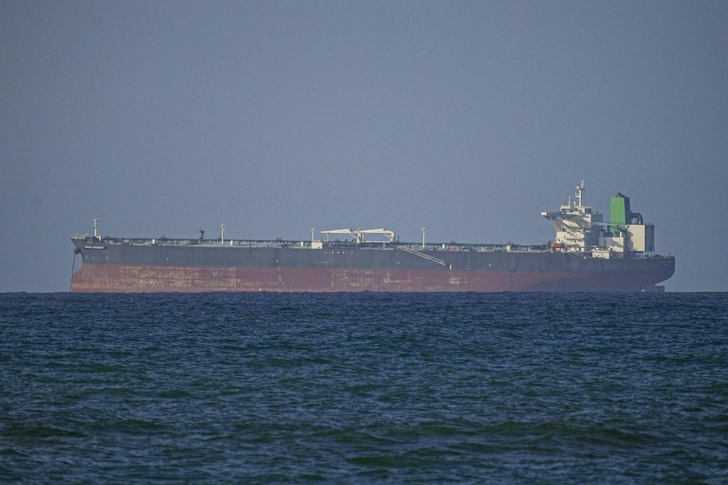 Three oil supertankers sail through the Strait of Hormuz