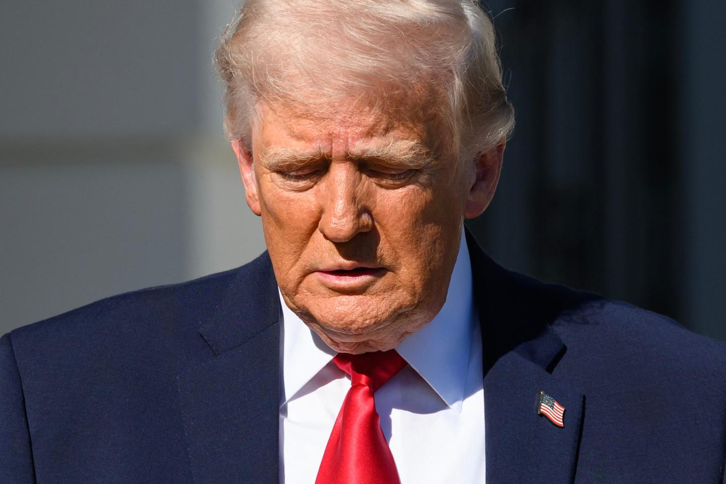 President Donald Trump walks towards reporters before boarding Marine One to depart from the White House in Washington, DC, on April 11, 2026. 