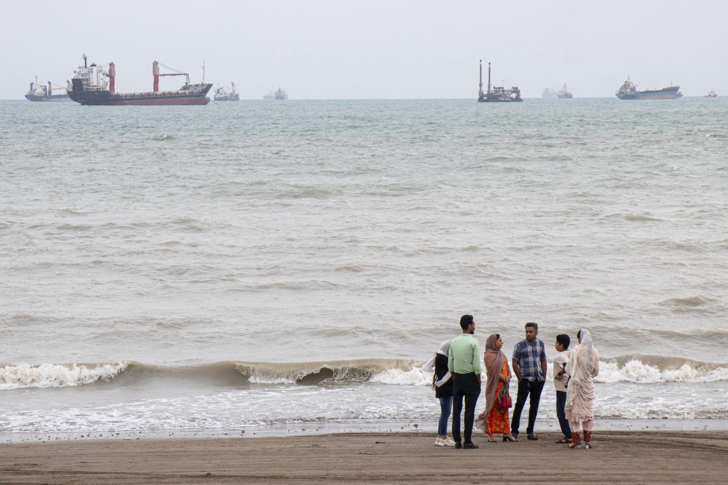 Iranians are seen at Suru Beach in Bandar Abbas along the Strait of Hormuz.