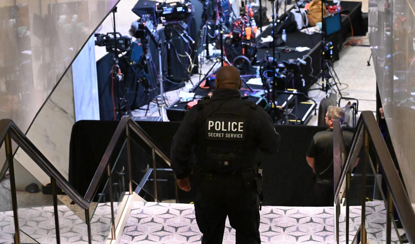 A Secret Service police officer walks through the lobby of the Washington Hilton after shots were heard during the White House Correspondents' Dinner in Washington, DC, on April 25, 2026.