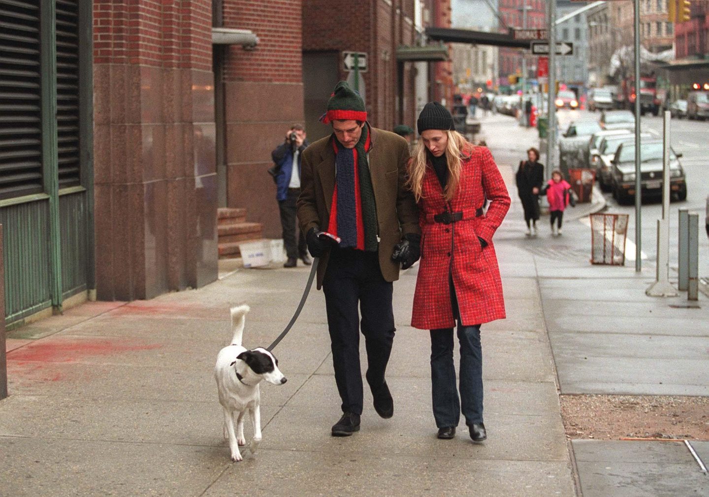 JFK, jr and Carolyn Bessette walk their dog in New York City.