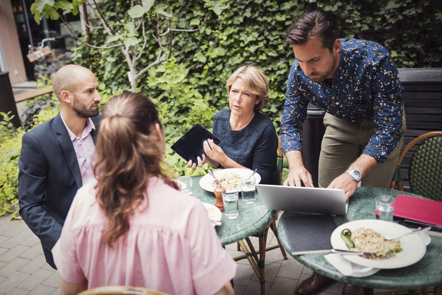Boss has lunch with her workers outside