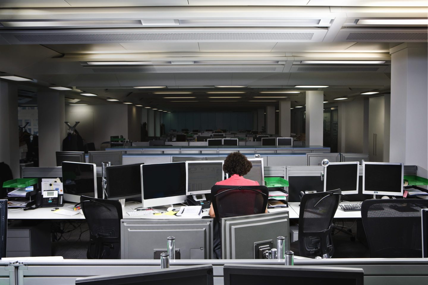 A woman working alone in an office