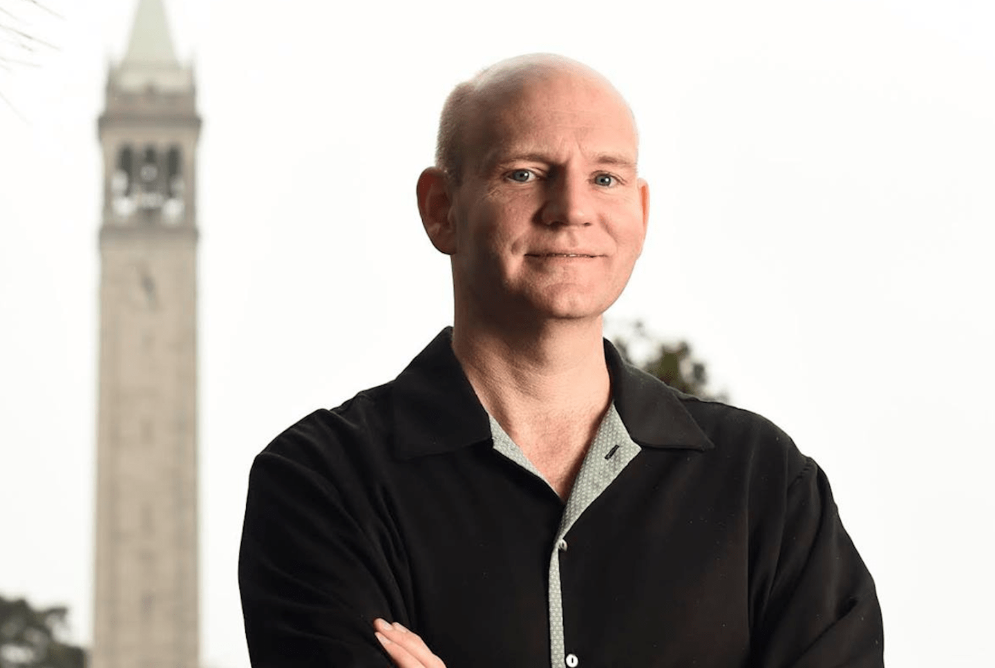 Mike Horton poses with his arms crossed.