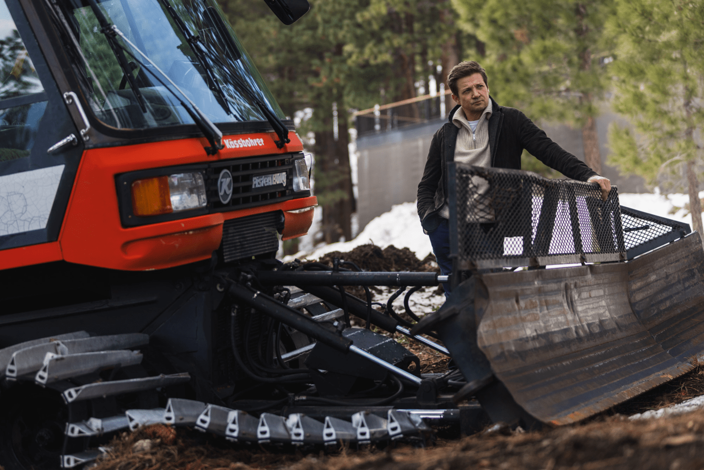 Jeremy Renner and snowcat