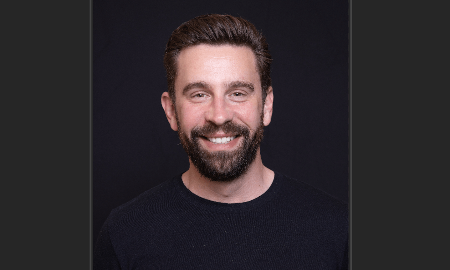 In this photo illustration, Checkr logo is seen on a smartphone and on a pc screen.