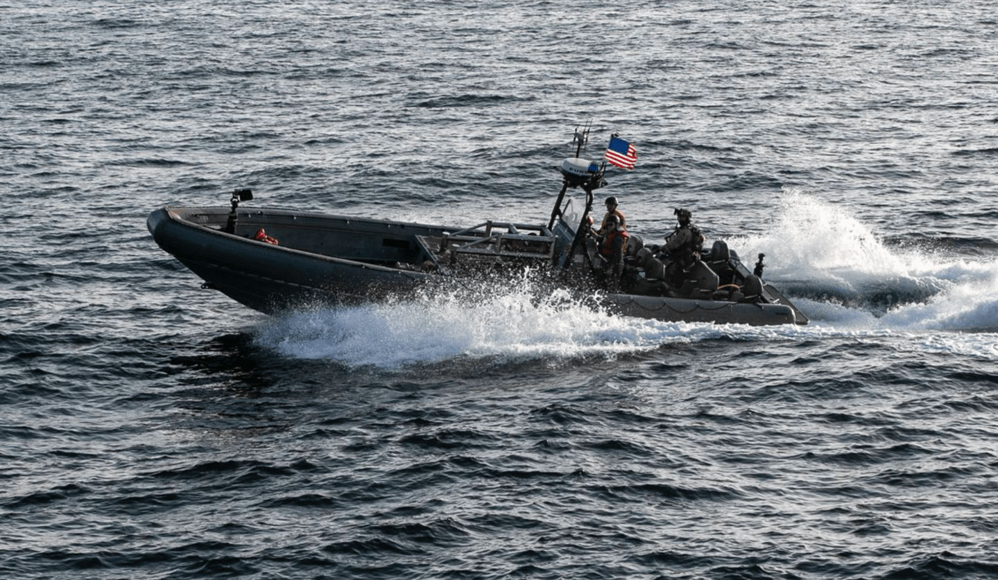 U.S. forces patrol the Arabian Sea near M/V Touska, April 20, as the Iranian-flagged vessel's container cargo is searched after U.S. Marines boarded and seized the ship when it attempted to violate the U.S. naval blockade.