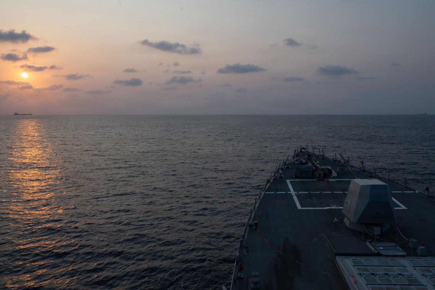 Guided-missile destroyer USS Pinckney (DDG 91) escorts a vessel while conducting blockade operations, April 22, 2026.