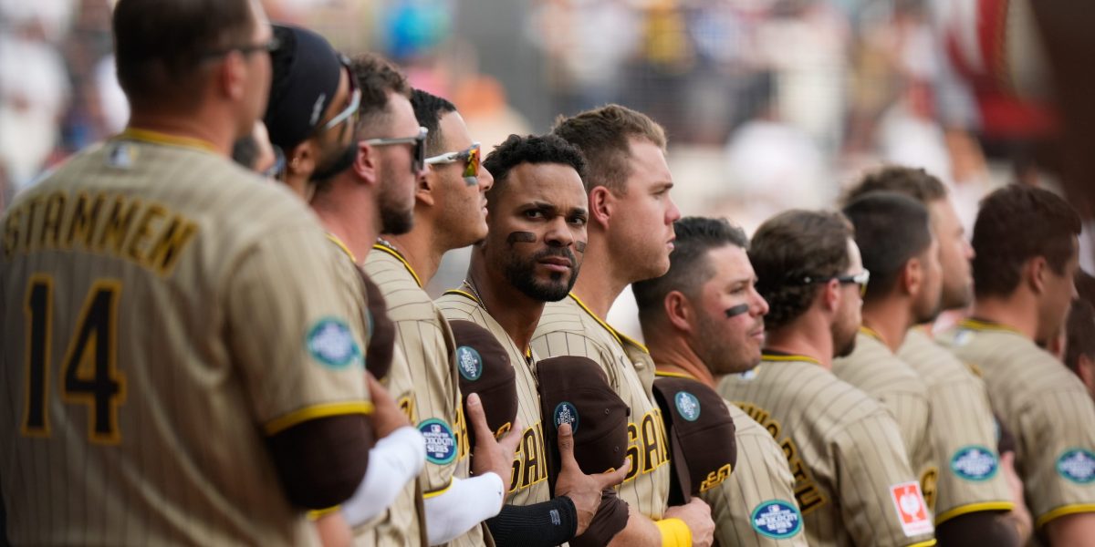 San Diego Padres' Xander Bogaerts, center, and teammate stand line prior to a baseball game against Arizona Diamondbacks in Mexico City, Saturday, April 25, 2026.