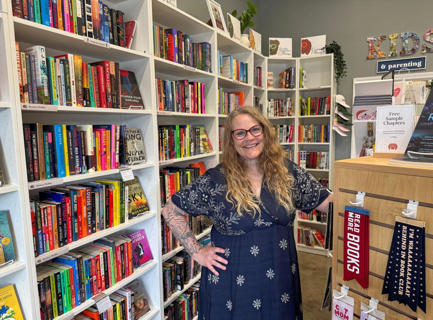 Owner Kelley Hartnett poses at her Double Dog Bookshop in Wentzville, Missouri, on Wednesday, May 27, 2026.