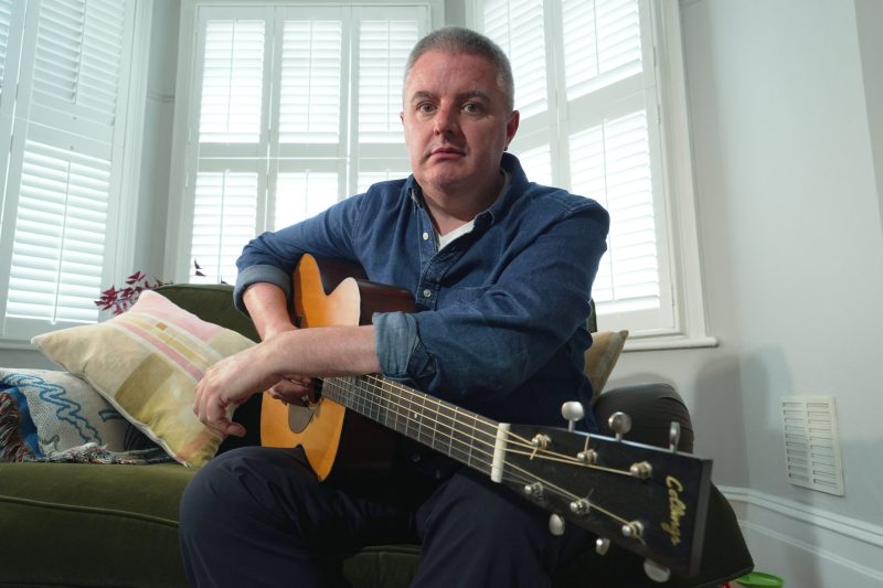 AI is splitting the music world. This 49-year-old guitarist used it to keep playing after Parkinson’s