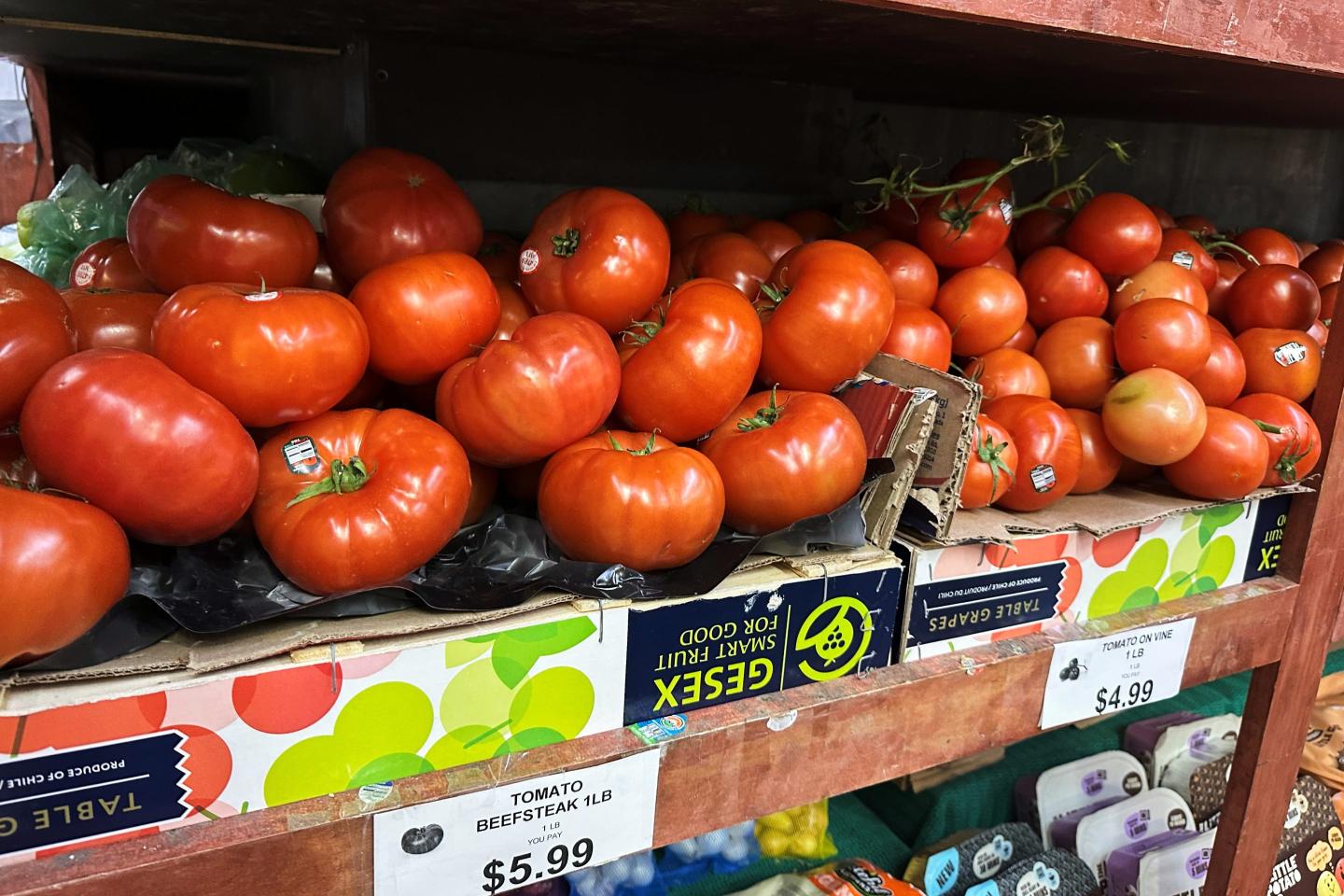 Tomatoes await customers on the shelves of a supermarket in New York on Tuesday, May 26, 2026.