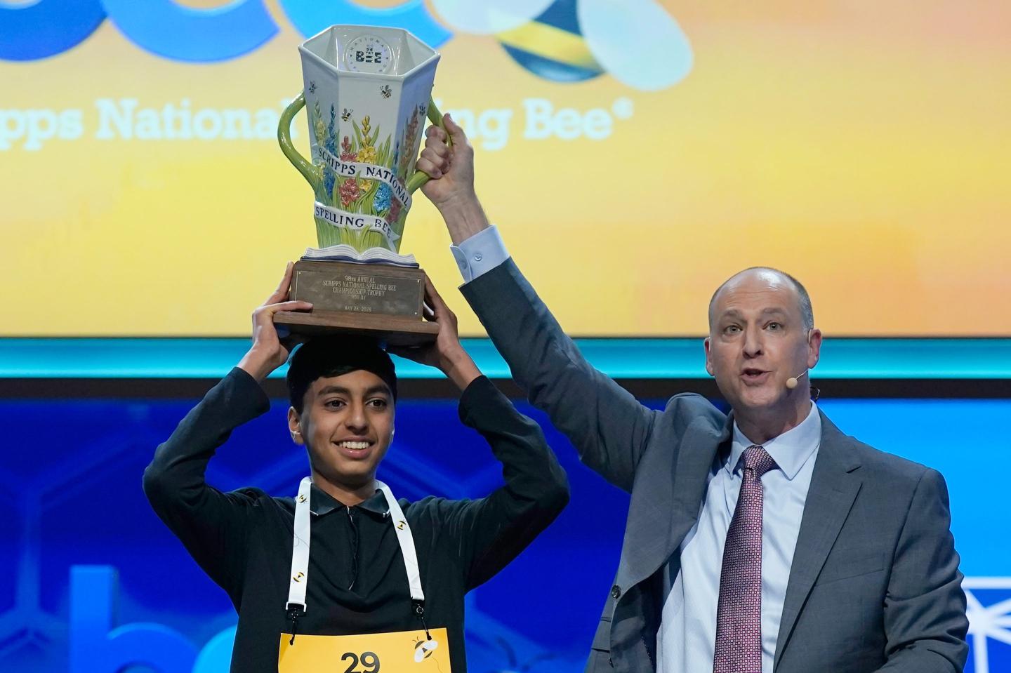 E.W. Scripps Company president and CEO Adam Symson, right, holds the trophy over winner of the 2026 Scripps National Spelling Bee, Shrey Parikh, 14, of Rancho Cucamonga, Calif., at DAR Constitution Hall, Thursday, May 28, 2026, in Washington.
