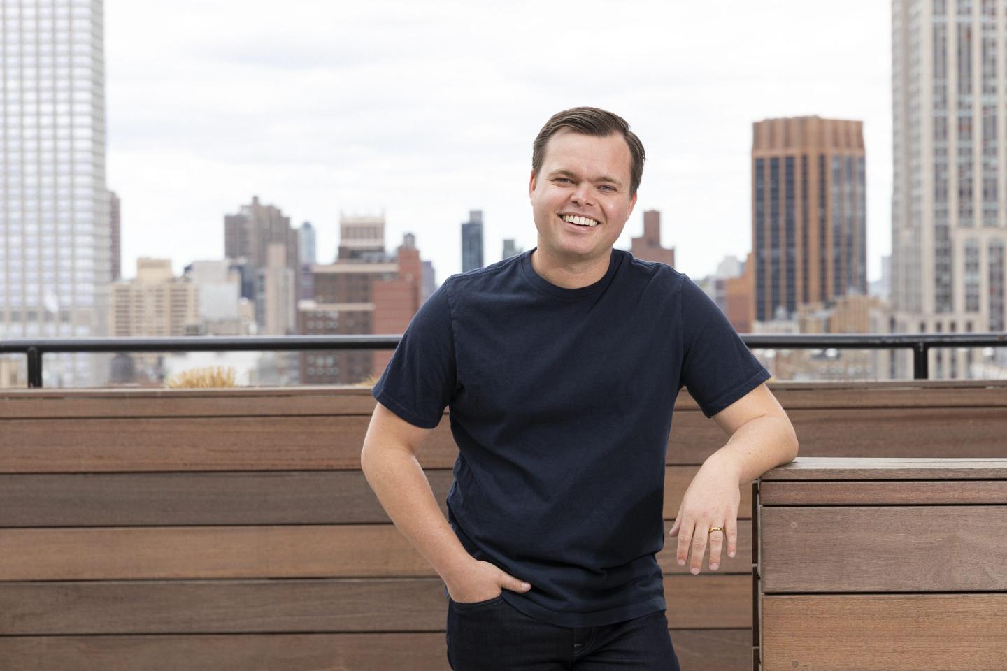Allen Osgood, co-founder and CEO of Eisen, in front of the New York City skyline