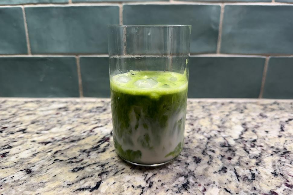 A glass of Mantra Matcha Super Premium Ceremonial Matcha with ice