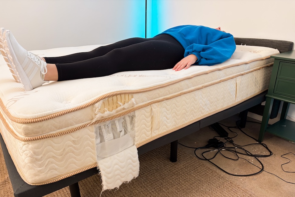 A woman back sleeping on the Saatva Latex Hybrid mattress