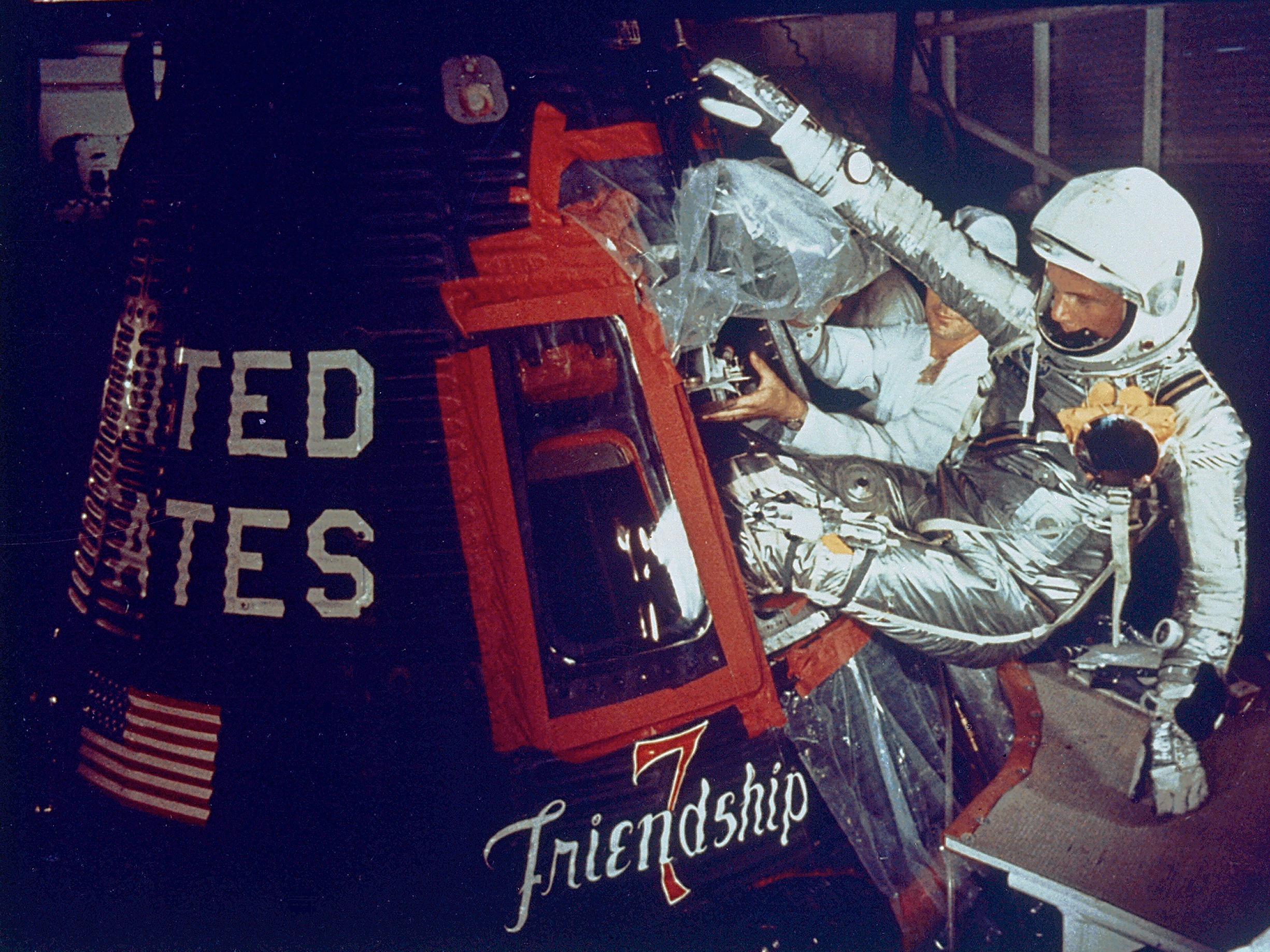 1962: Astronaut John Glenn enters the Friendship 7 to become the first American to orbit the Earth.