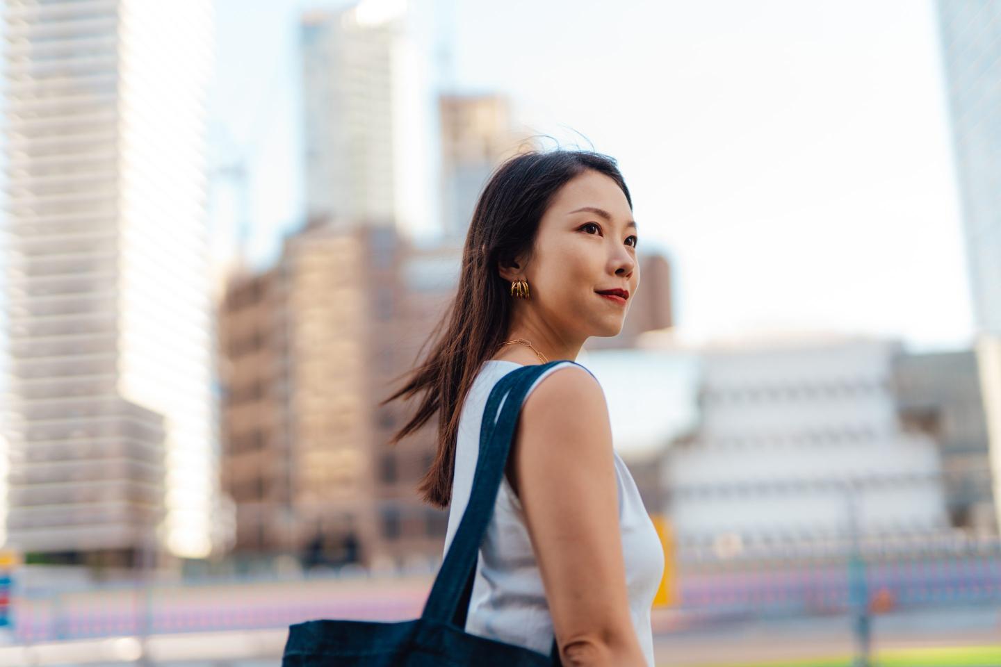 Young college graduate in city