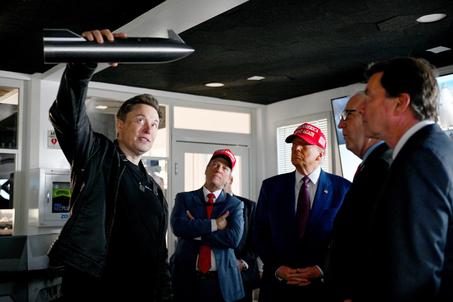 Elon Musk gives a tour to U.S. President-elect Donald Trump and lawmakers of the control room before the launch of the sixth test flight of the SpaceX Starship rocket on November 19, 2024 in Brownsville, Texas.