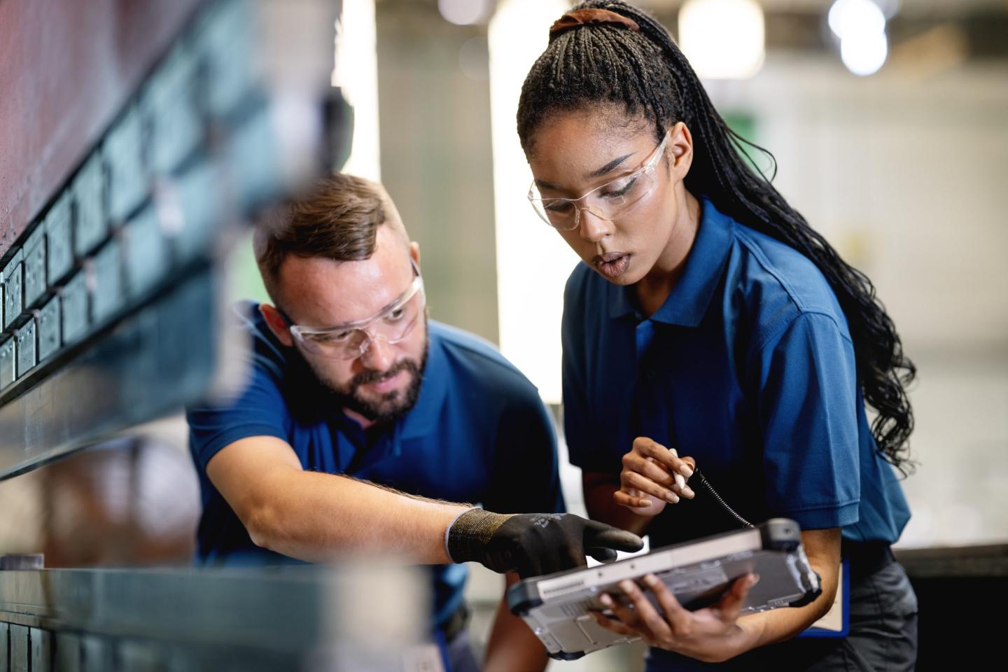 Young trade worker learning on job
