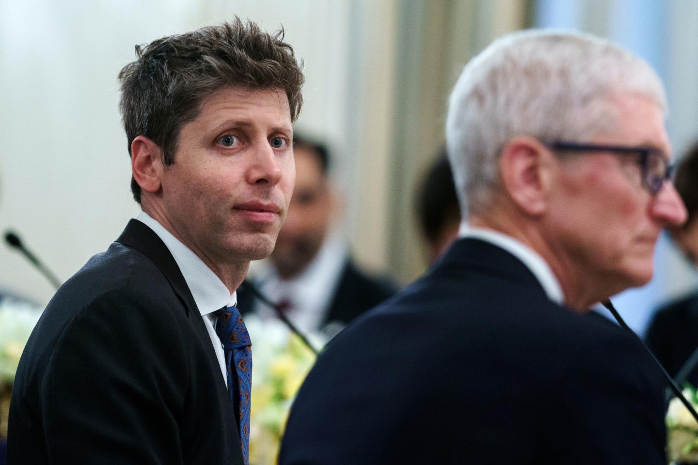 OpenAI CEO Sam Altman (left) and Apple CEO Tim Cook in Washington, D.C., on Sept. 4, 2025. (Photo: Will Oliver/EPA/Bloomberg/Getty Images)