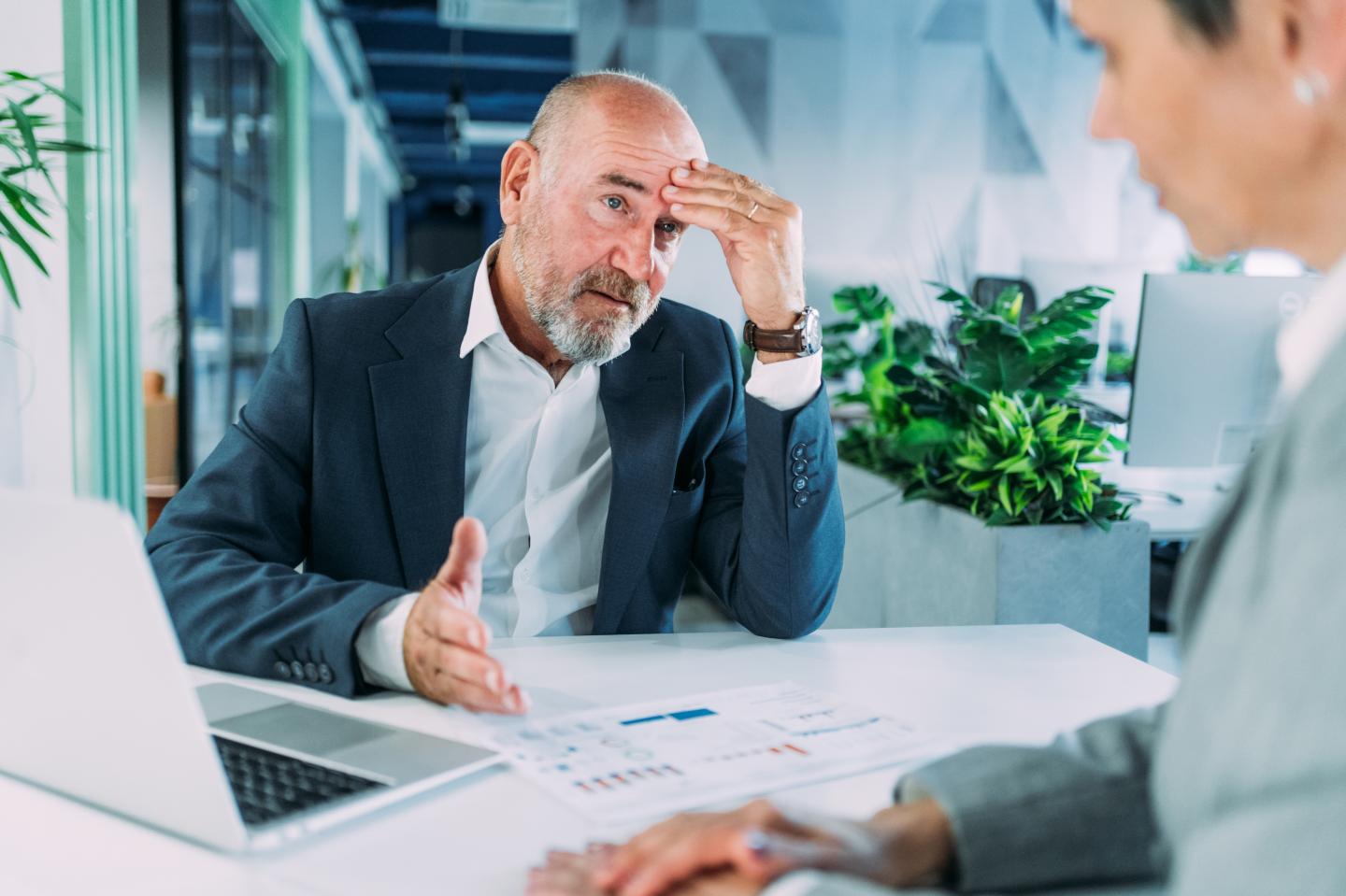 Frustrated man in work meeting
