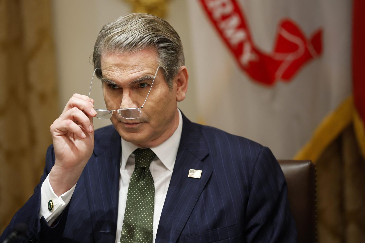 U.S. Treasury Secretary Scott Bessent adjusts his glasses during a meeting with U.S. President Donald Trump and President of Argentina Javier Milei in the Cabinet Room at the White House on October 14, 2025 in Washington.