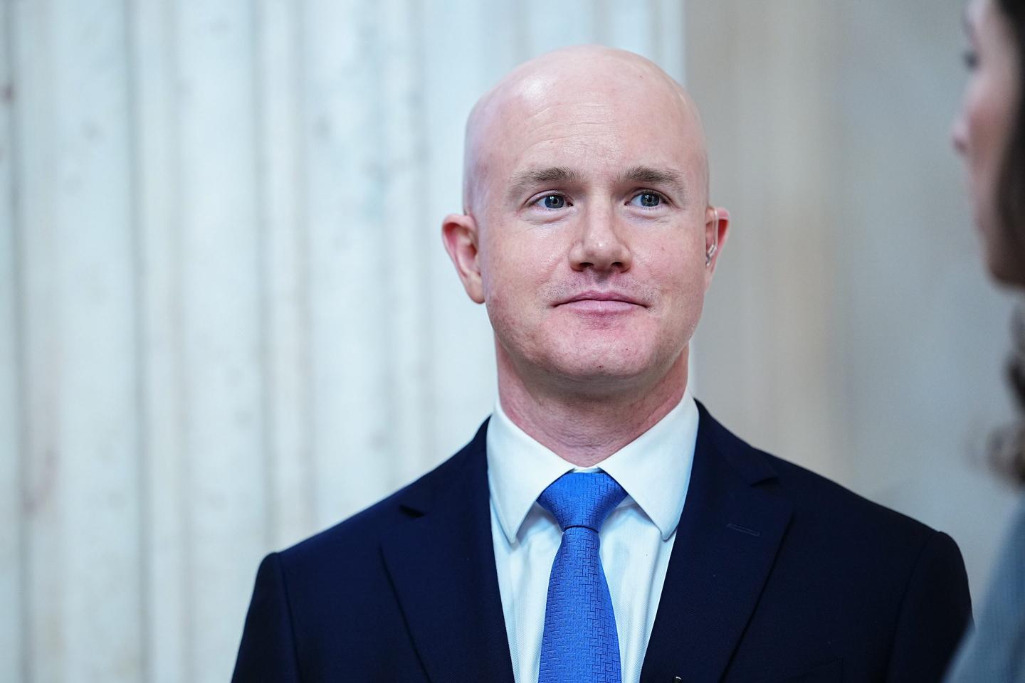 Coinbase didn’t just lay off 14% of its staff due to AI. It replaced managers with ‘player-coaches’ and turned its org chart upside down