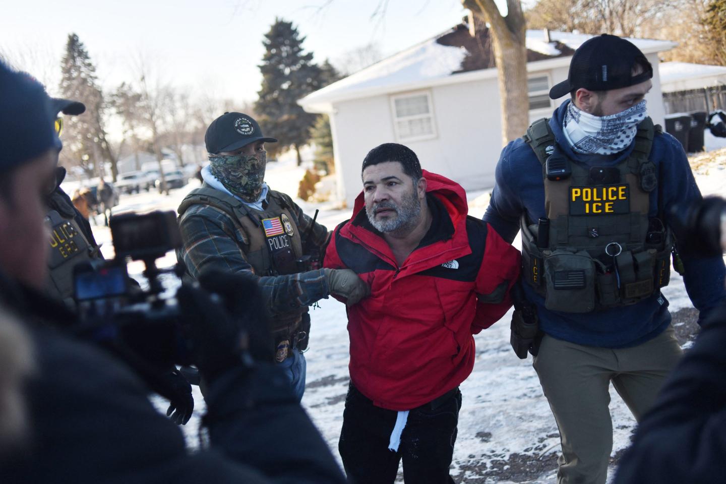 Federal immigration agents detain a man during an operation by US Immigration and Customs Enforcement (ICE) and Border Patrol in St. Paul, Minnesota, on January 27, 2026.