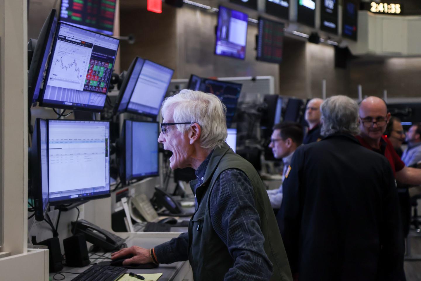Traders work after a Federal Open Market Committee (FOMC) meeting on the floor of the New York Stock Exchange (NYSE) in New York, US, on Wednesday, March 18, 2026.