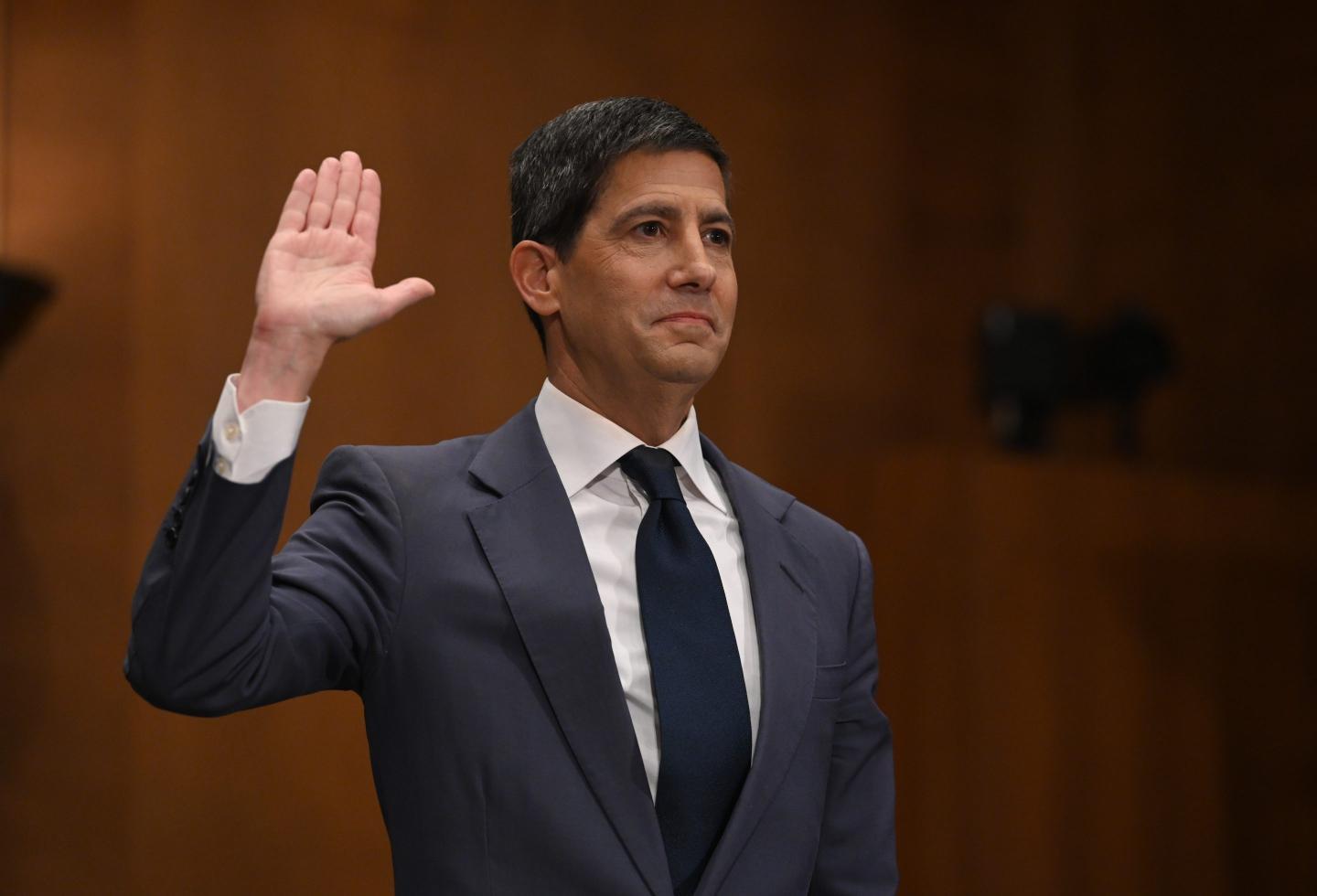 Kevin Warsh, chairman of the US Federal Reserve nominee for US President Donald Trump, is sworn in during a Senate Banking, Housing, and Urban Affairs Committee confirmation hearing on April 21, 2026 in Washington, DC.