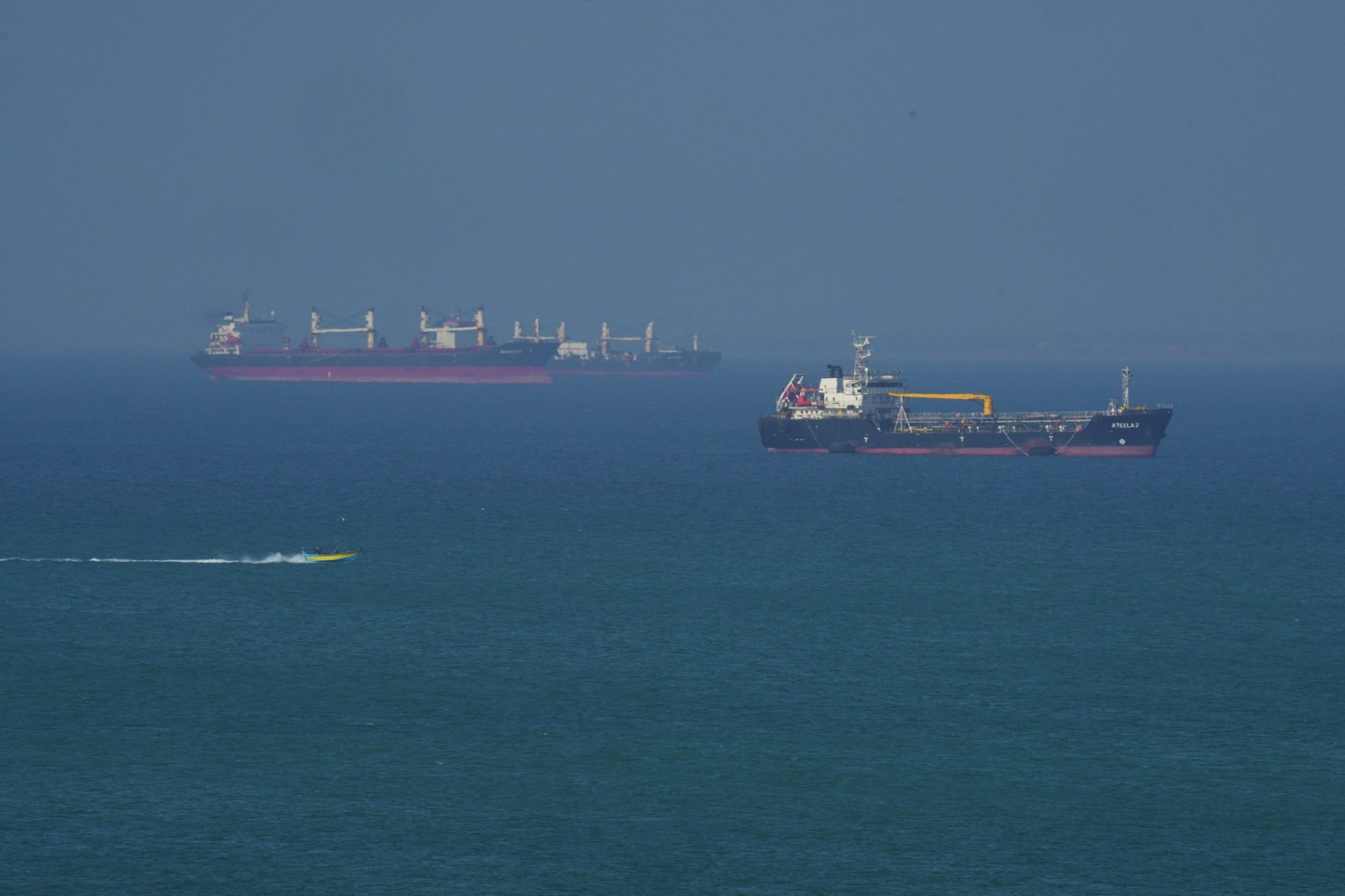 Shaky Iran war ceasefire tested again as drone hits cargo ship off Qatar coast while Kuwait and UAE repel drone attacks