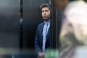 Sam Altman standing in a lift.