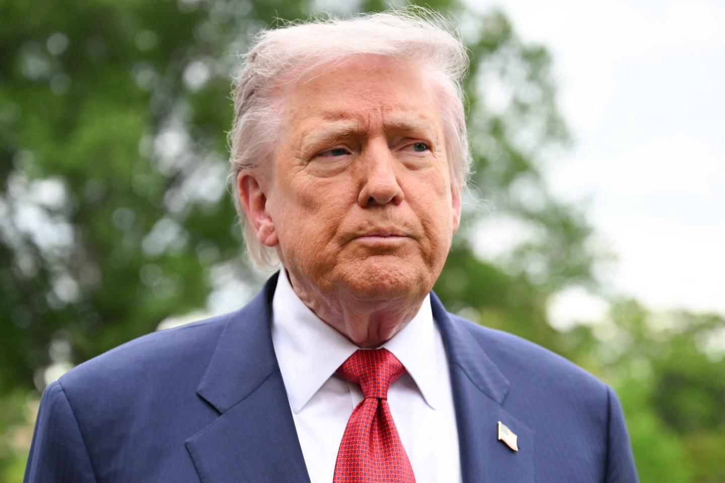 US President Donald Trump speaks to journalists as he makes his way to board Marine One before departing from the South Lawn of the White House in Washington, DC on May 8, 2026.