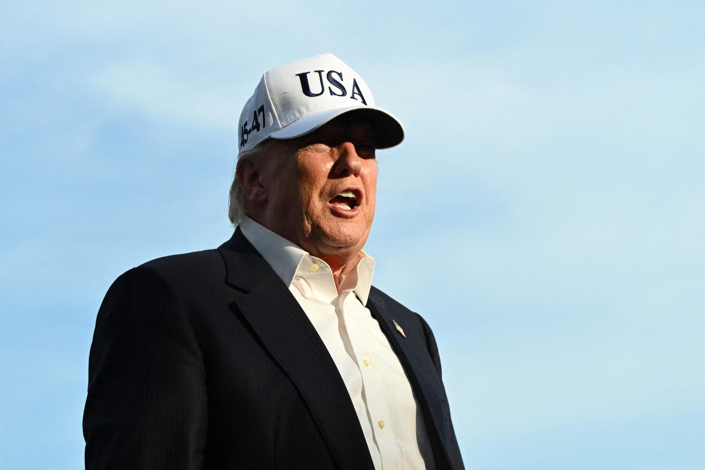US President Donald Trump speaks to reporters after arriving on the South Lawn of the White House in Washington, DC, on May 15, 2026.