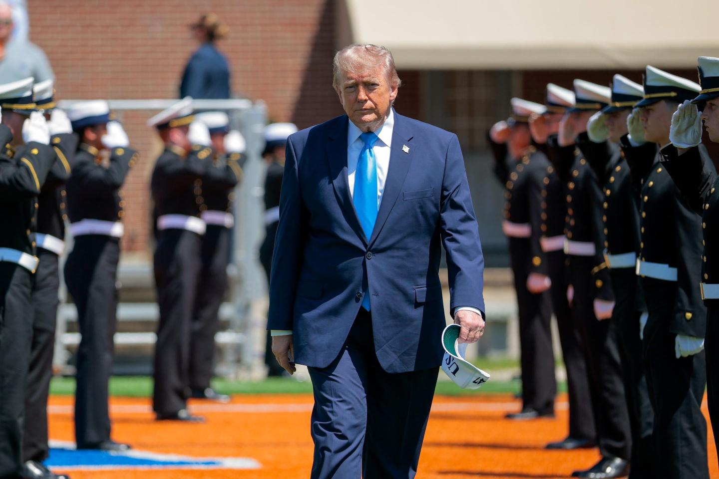 U.S. President Donald Trump arrives to the commencement ceremony on Cadet Memorial Field at the United States Coast Guard Academy on May 20, 2026 in New London, Connecticut.