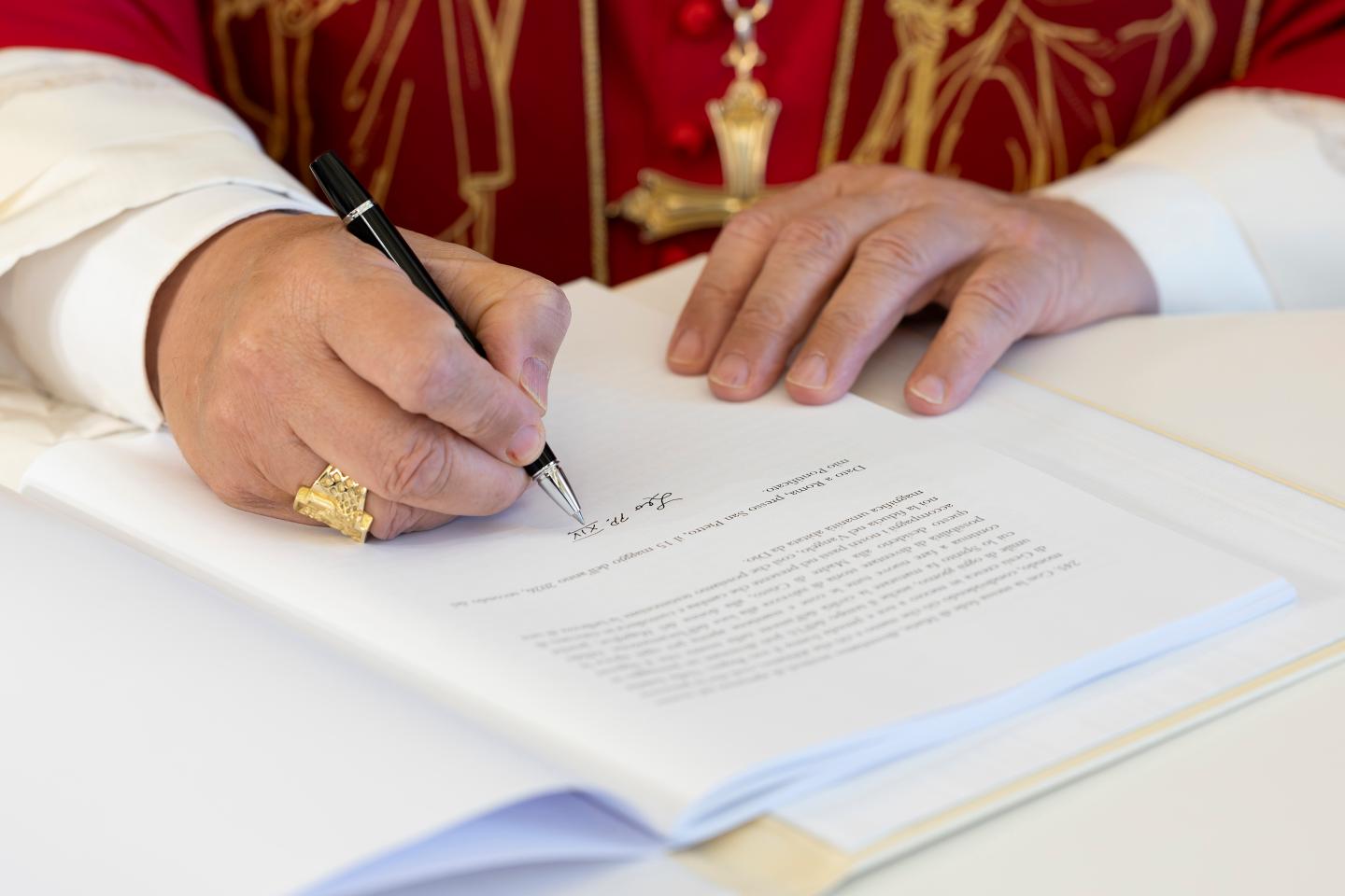 Pope Leo XIV signs "Magnifica humanitas" at the Apostolic Palace on May 25, 2026 in Vatican City, Vatican. (Photo: Simone Risoluti/Vatican Media/Vatican Pool/Getty Images)
