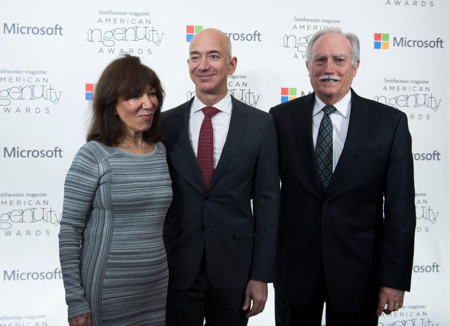 Amazon CEO Jeff Bezos (center) with his parents, Mike and Jackie