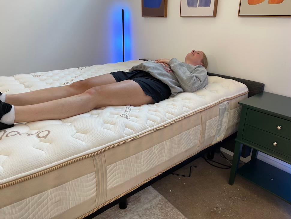 A woman back sleeping on the Saatva Rx mattress