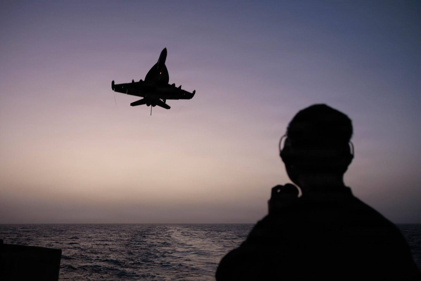 Sailor observes an F/A-18E Super Hornet while standing lookout watch aboard Nimitz-class aircraft carrier USS George H.W. Bush (CVN 77), May 29, 2026. 