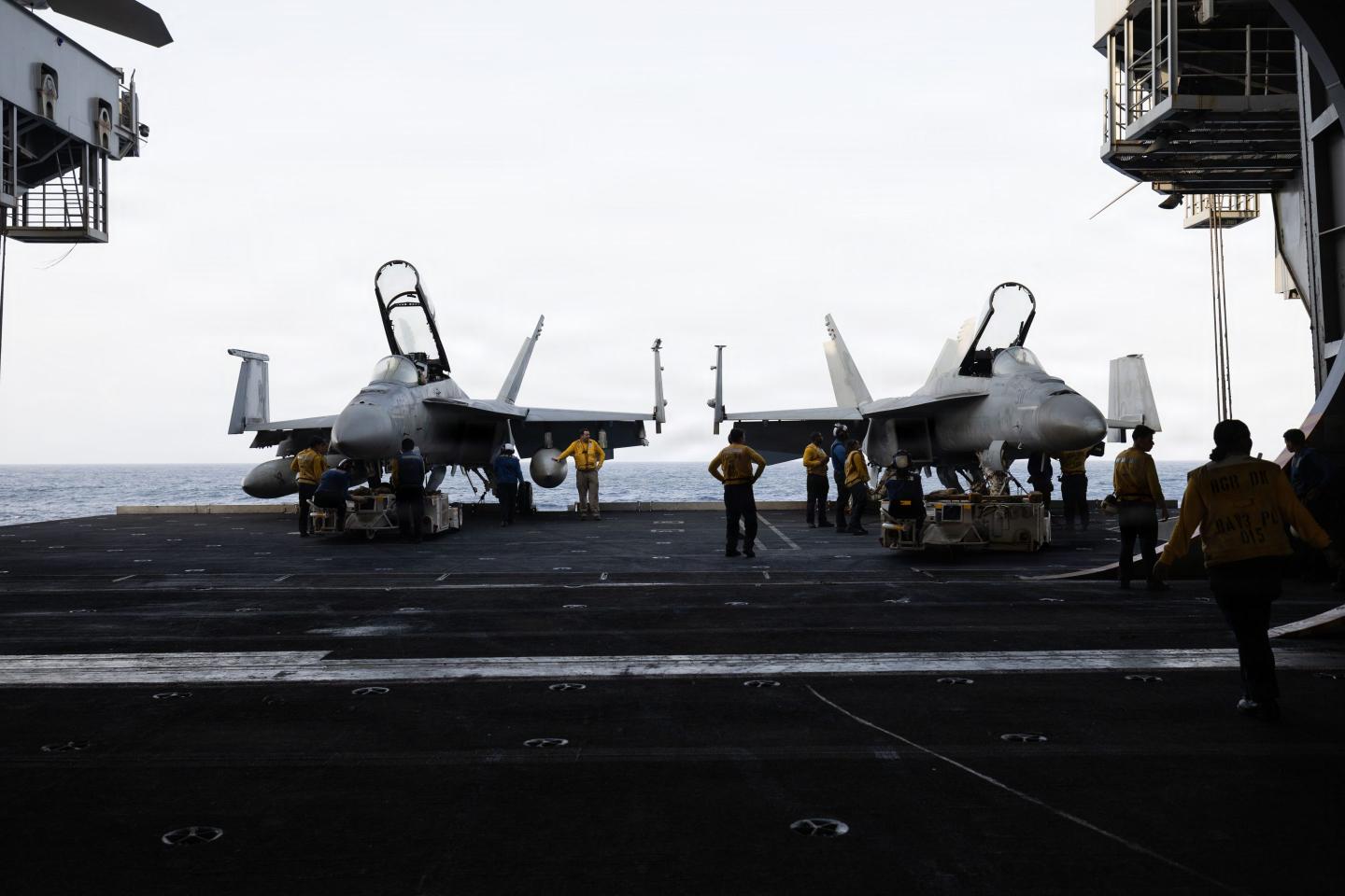 Sailors prepare to transport aircraft aboard Nimitz-class aircraft carrier USS George H.W. Bush (CVN 77) while sailing in the Arabian Sea, June 20, 2026.