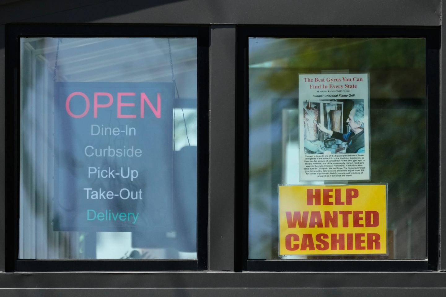 A hiring sign is displayed at a restaurant in Morton Grove, Ill., Thursday, May 14, 2026. (AP Photo/Nam Y. Huh)
