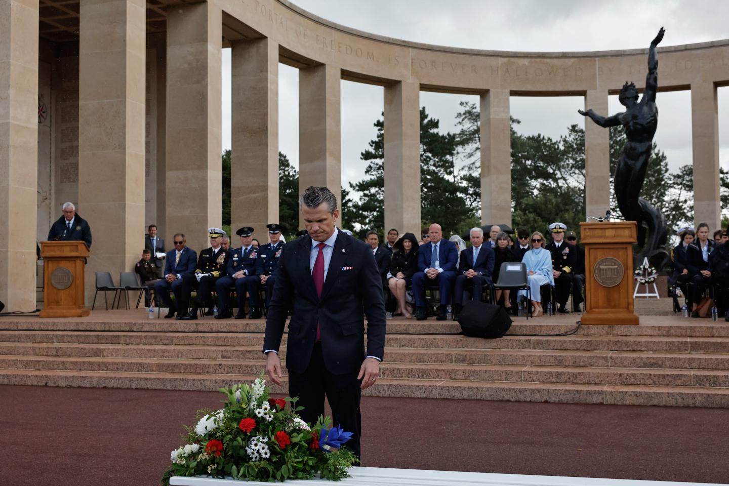 Defense Secretary Pete Hegseth lays a wreath of flowers during a ceremony at the US cemetery to commemorate the 82nd anniversary of the D-Day landings, in Colleville-sur-Mer, Normandy, France, Saturday, June 6, 2026.