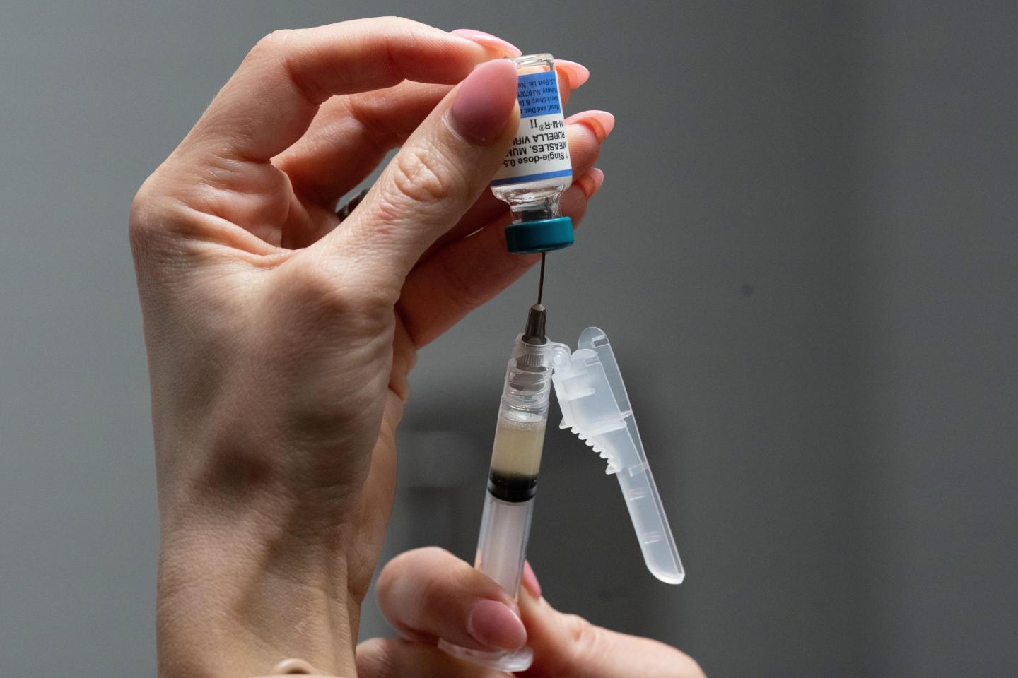A nurse, prepares a combination measles, mumps and rubella vaccine for a patient at Tiger Pediatrics in Easley, S.C., March 17, 2026.